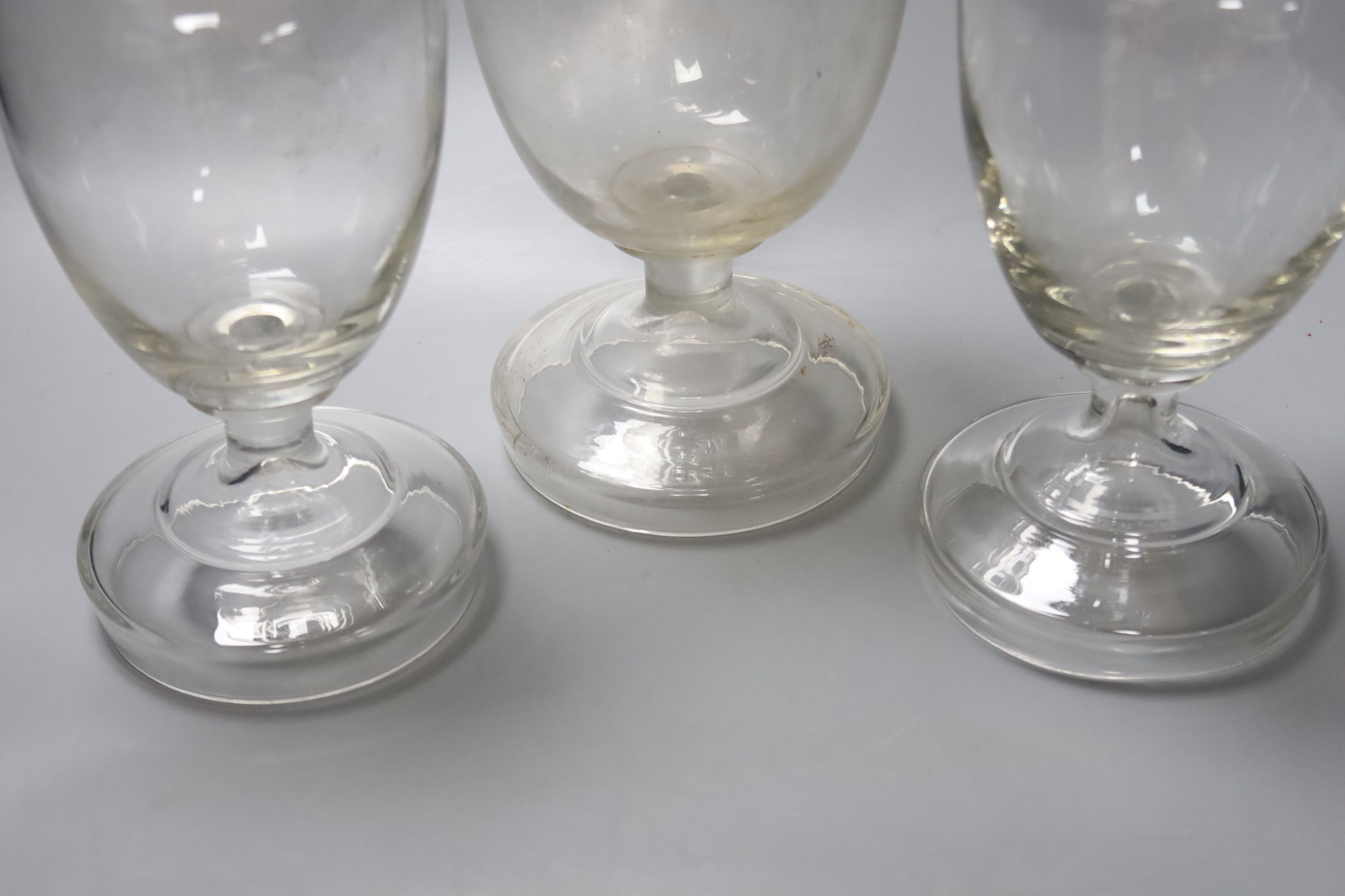 A garniture of three Victorian glass sweet jars, tallest 34cm